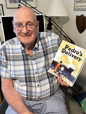 Mark holding the first printing of Pedro's Delivery